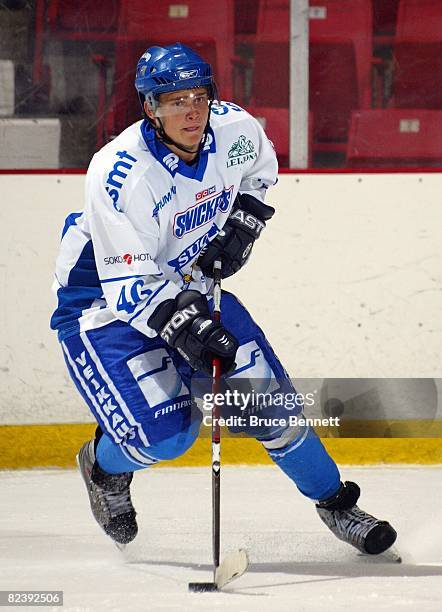 Eetu Poysti of Team Finland jumps over the boards to play against Team USA at the USA Hockey National Junior Evaluation Camp on August 8, 2008 at the...