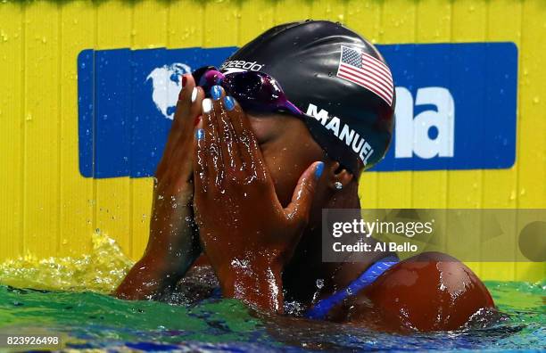 Simone Manuel of the United States celebrates after winning the gold medal during the Women's 100m Freestyle final on day fifteen of the Budapest...