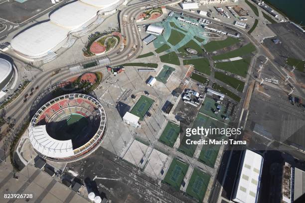 Some remaining tennis courts stand next to the main tennis stadium in Olympic Park in the Barra da Tijuca neighborhood on July 27, 2017 in Rio de...