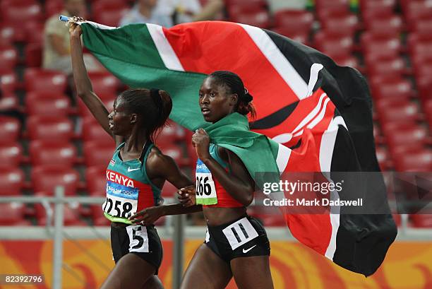 Eunice Jepkorir Kertich of Kenya and Ruth Bosibori Nyangau of Kenya parade with their national flag following the Women's 3000m Steeplechase Final...