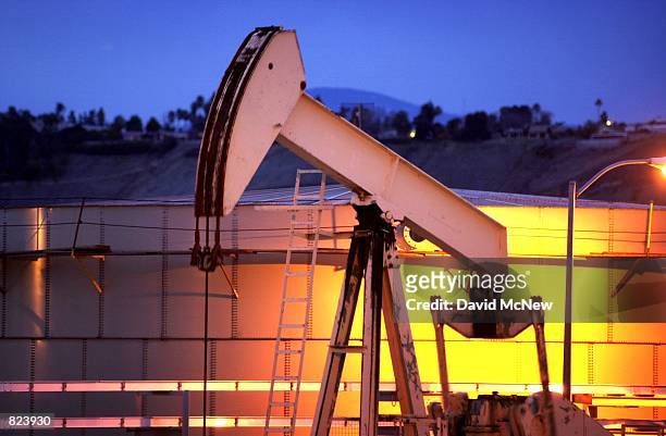 Pump draws oil in the Kern River Oil Field, February 16 near Oildale, CA. In recent months the state Coastal Commission has been battling the federal...