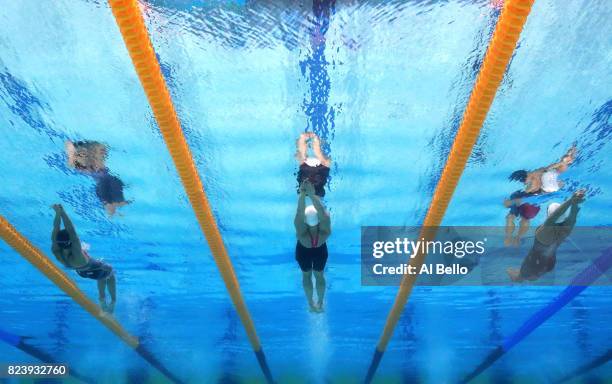 Regan Smith of the United States, Katinka Hosszu of Hungary and Hilary Caldwell of Canada compete during the Women's 200m Backstroke semi final on...