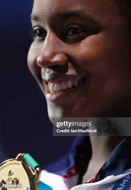 Simone Manuel of United States poses with her gold medal after she wins the Women's 100m Freestyle during day fiifteen of the FINA World...