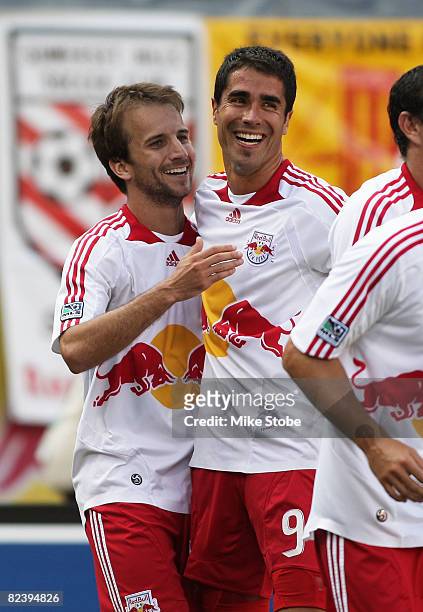 Mike Magee of the New York Red Bulls celebrates his goal in the 37th minute with teammate Juan Pablo Angel against theToronto FC at Giants Stadium in...