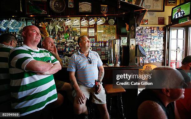 Tourists watch the Celtic v Dundee United while on holiday on August 17, 2008 in Malgrat de Mar, Spain. Feeling the pinch from the credit crunch many...