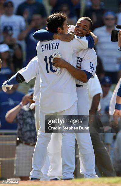 Andre Ethier and Matt Kemp of the Los Angeles Dodgers celebrate after both scored on Ethier's walk off two run home run in the bottom of the ninth...