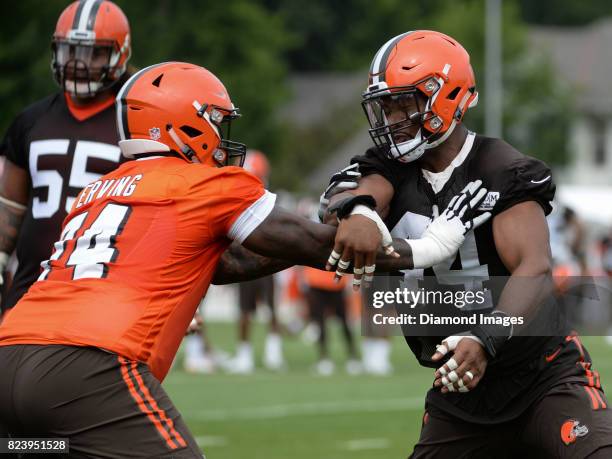 Defensive lineman Nate Orchard and offensive lineman Cameron Erving of the Cleveland Browns engage during a training camp practice on July 27, 2017...