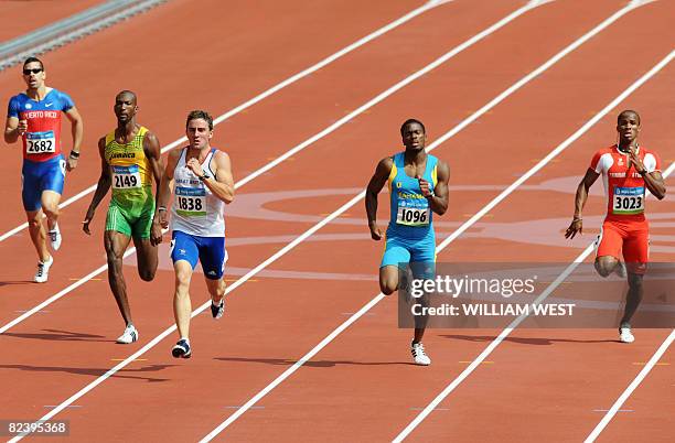 Felix Martinez of Puerto Rico, Jamaica's Michael Blackwood, Great Britain's Andrew Steele, Bahamas' Michael Matieu and Trinidad Renny Quow compete in...