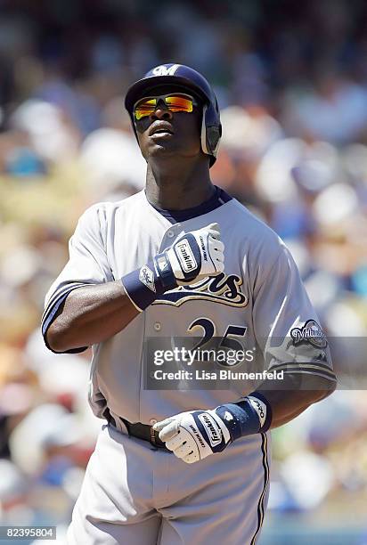 Mike Cameron of the Milwaukee Brewers celebrates after hitting a homerun in the fourth inning against the Los Angeles Dodgers at Dodger Stadium on...