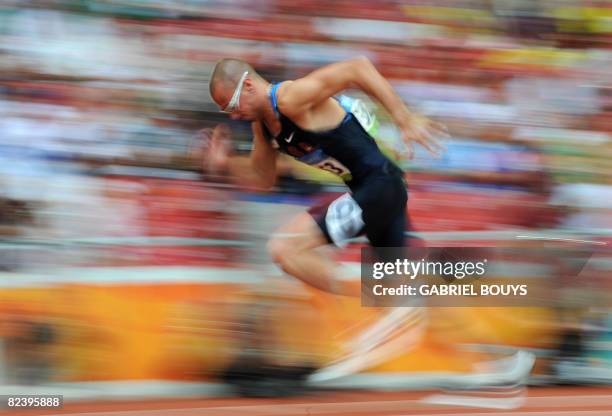 Athlete Jeremy Wariner leaves the blocks at the start of heat 7 of the first round of the men's 400m heats at the "Bird's Nest" National Stadium...