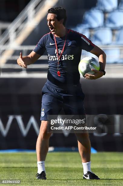 Paris Saint-Germain's Spanish coach Unai Emery gives instructions during a training session at the Grand Stade in Tangiers on July 28, 2017 on the...
