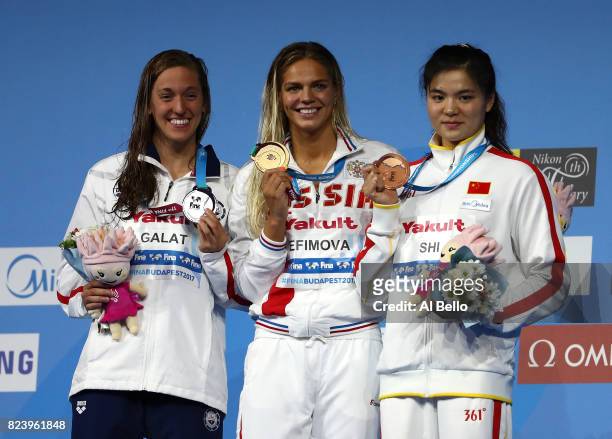 Silver medalist Bethany Galat of the United States, gold medalist Yuliya Efimova of Russia and bronze medalist Jinglin Shi of China pose with the...
