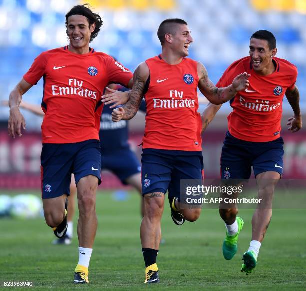 Paris Saint-Germain's Uruguayan forward Edinson Cavani, Paris Saint-Germain's Italian midfielder Marco Verratti and Paris Saint-Germain's Argentinian...