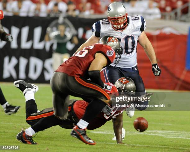 Defensive end Marques Douglas of the Tampa Bay Buccaneers dives for a loose ball against the New England Patriots at Raymond James Stadium on August...