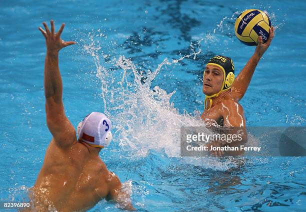 Thomas Whalan of Australia takes a shot at goal during the match against Montenegro in the preliminary round group A water polo match at the Ying...