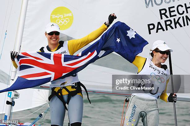 Elise Rechichi and Tessa Parkinson of Australia celebrate overall victory following the Women's 470 class medal race held at the Qingdao Olympic...