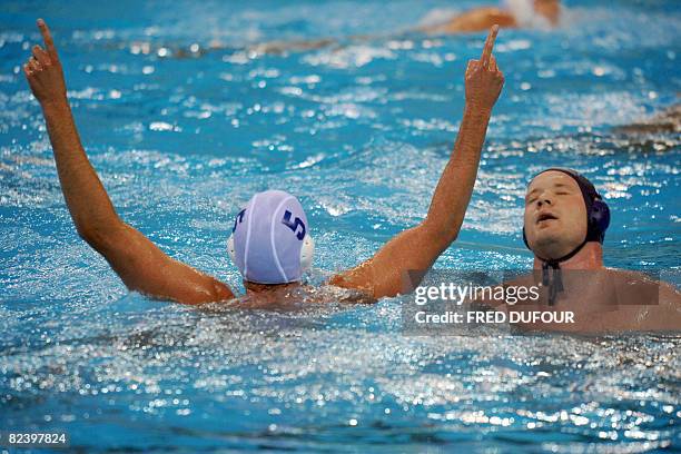 Adam Wright of the US jubilates after scoring a goal during their men's preliminary, group B water polo match of the 2008 Beijing Olympics Games on...