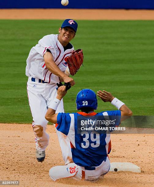 South Korea's Lee Jong-wook is forced out at second base as Taiwan's Chiang Chih-Hsien tries to turn the double-play in the top of the ninth inning...