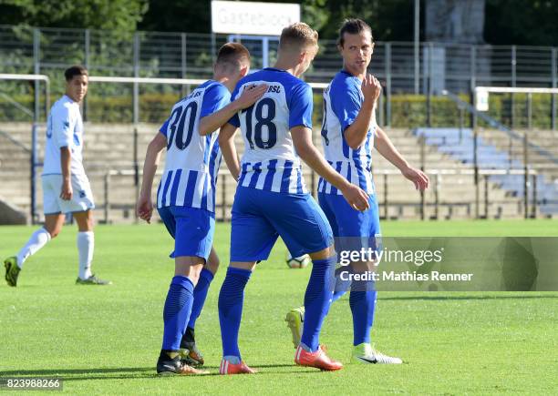 Julius Kade, Sinan Kurt and Valentin Stocker of Hertha BSC celebrate the goal during the test match between Hertha BSC and Club Italia Berlino on...