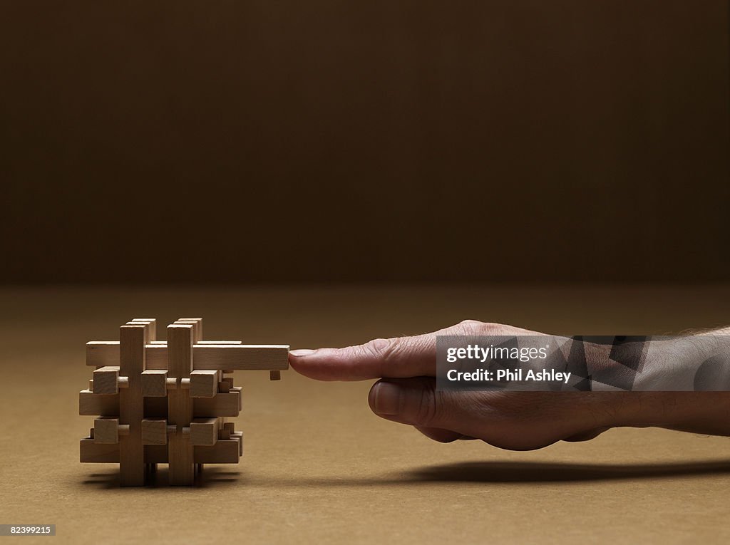 Man finishing the last piece of the puzzle