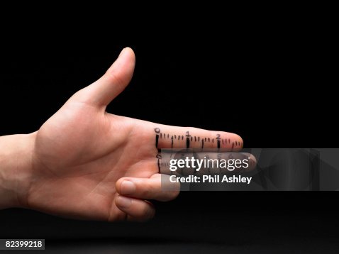 Ruler Marks Illustrated On A Mans Fingers High-Res Stock Photo - Getty ...