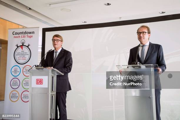 German Transport Minister Alexander Dobrindt and Deutsche Bahn Infrastructure Manager Ronald Pofalla are pictured during a news conference regarding...