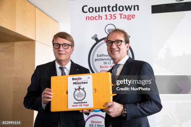 German Transport Minister Alexander Dobrindt and Deutsche Bahn Infrastructure Manager Ronald Pofalla are pictured during a news conference regarding...