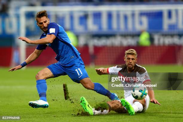 Lasse Sobiech of St. Pauli challenges Dimitrios Diamantakos of Bochum during the Second Bundesliga match between VfL Bochum 1848 and FC St. Pauli at...