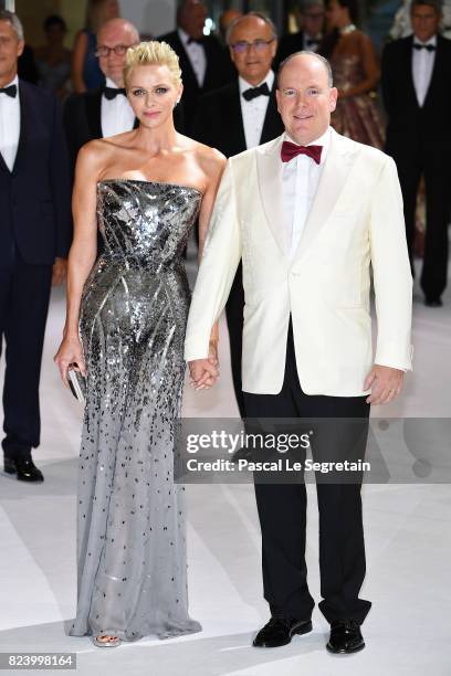 Princess Charlene of Monaco and Prince Albert II of Monaco attend the 69th Monaco Red Cross Ball Gala at Sporting Monte-Carlo on July 28, 2017 in...