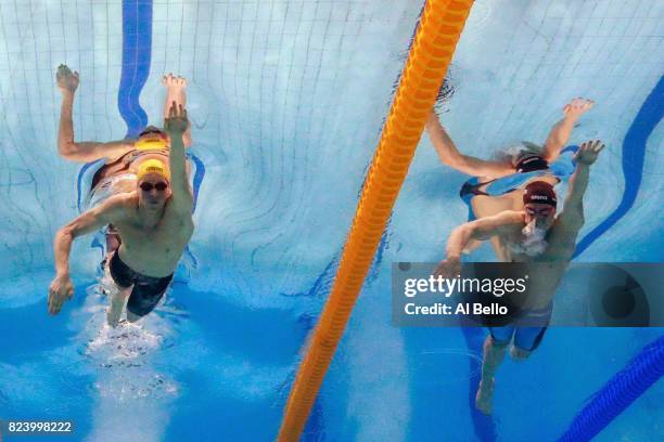 Mack Horton of Australia and Mikhail Dovgalyuk of Russia compete during the Men's 4x200m Freestyle final on day fifteen of the Budapest 2017 FINA...