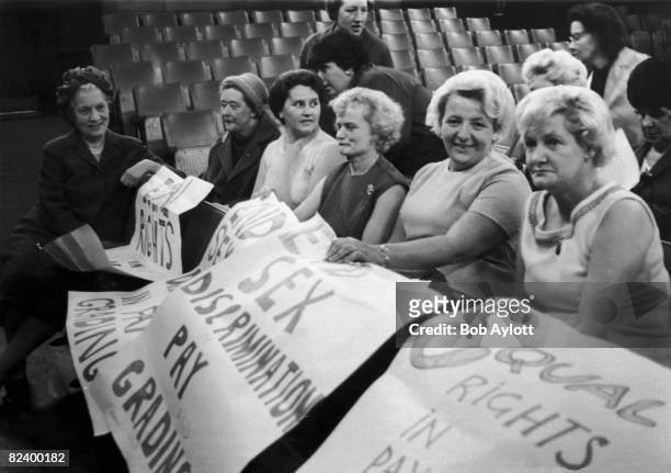British Labour politician Baroness Edith Summerskill chats to striking female machinists from the Ford plant in Dagenham, during a women's conference...