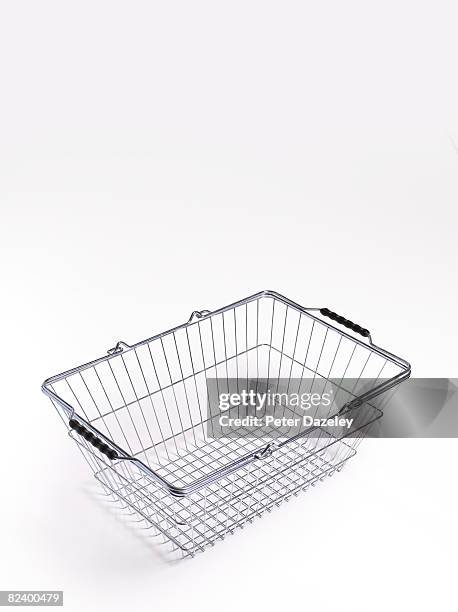 empty supermarket shopping basket - shopping basket stock pictures, royalty-free photos & images