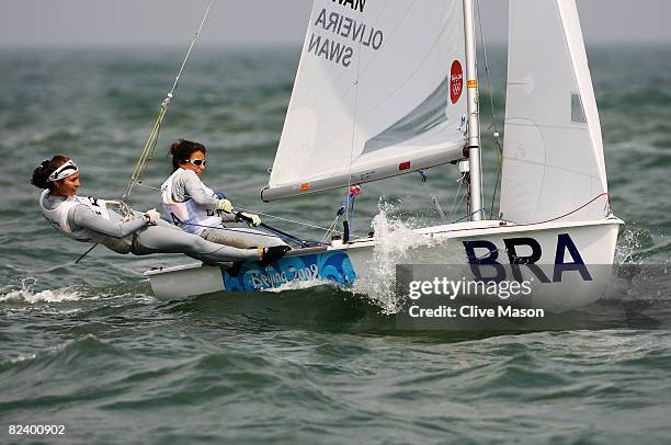 Fernanda Oliveira and Isabel Swan of Brazil compete on the way to finishing third overall in the Women's 470 class event held at the Qingdao Olympic...