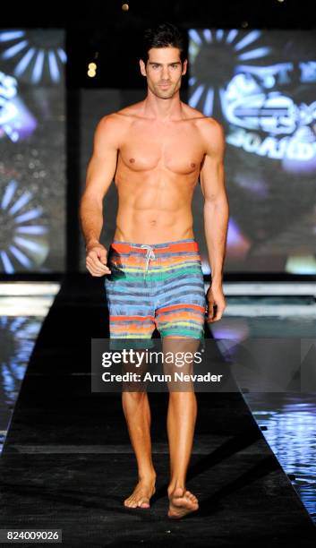 Model walks the runway for Just Bones Boardwear fashion show during Art Hearts Fashion Miami Swim Week at SLS Hyde Beach on July 22, 2017 in Miami,...