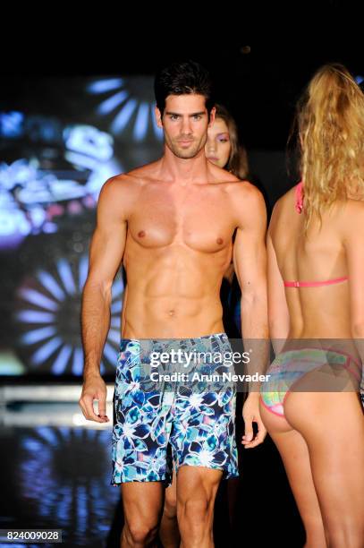 Model walks the runway for Just Bones Boardwear fashion show during Art Hearts Fashion Miami Swim Week at SLS Hyde Beach on July 22, 2017 in Miami,...