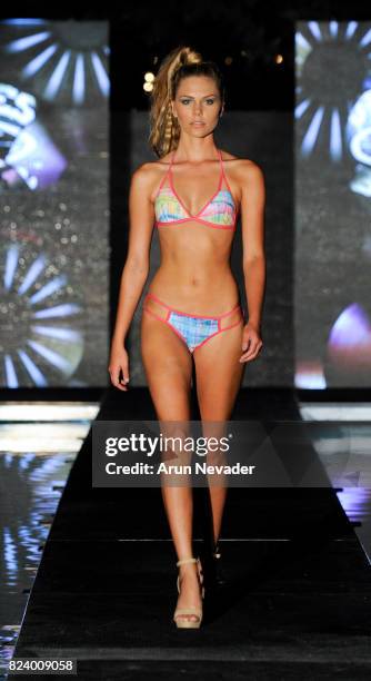 Model walks the runway for Just Bones Boardwear fashion show during Art Hearts Fashion Miami Swim Week at SLS Hyde Beach on July 22, 2017 in Miami,...