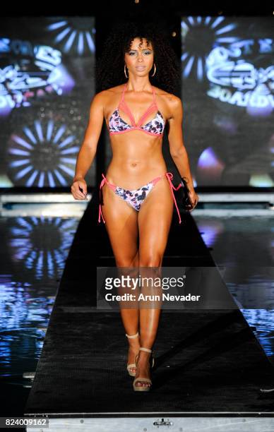 Model walks the runway for Just Bones Boardwear fashion show during Art Hearts Fashion Miami Swim Week at SLS Hyde Beach on July 22, 2017 in Miami,...