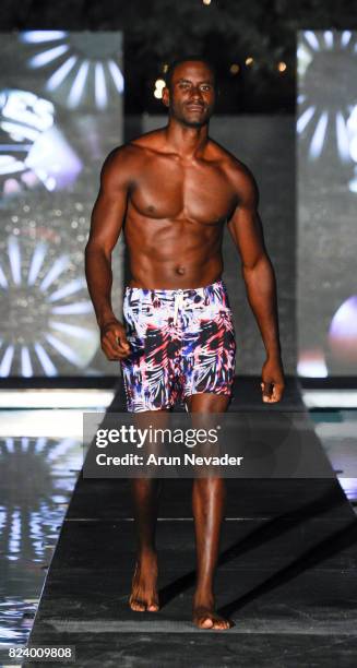 Model walks the runway for Just Bones Boardwear fashion show during Art Hearts Fashion Miami Swim Week at SLS Hyde Beach on July 22, 2017 in Miami,...