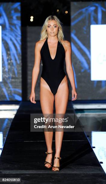 Model walks the runway during the Gabriela Pires fashion show for Art Hearts Fashion Miami Swim Week at SLS Hyde Beach on July 22, 2017 in Miami,...