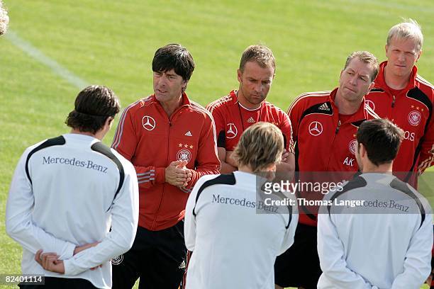 Head coach Joachim Loew, Hansi Flick, Andreas Koepke and Oliver Bartlett of Germany are seen during a training session of the German national...