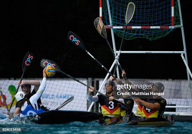 The German defence block a shot during the Canoe Polo Men's match between Italy and Germany of The World Games at Orbita Outdoor Swimming Pool on...