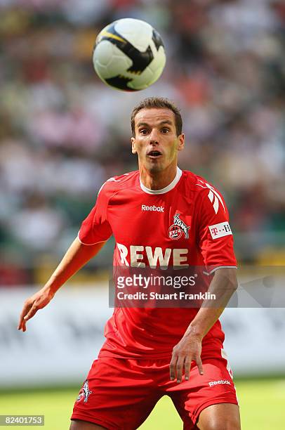 Petit of Koeln watches the ball during the first Bundesliga match between VfL Wolfsburg and 1. FC Koeln at the Volkswagen Arena on August 16, 2008 in...