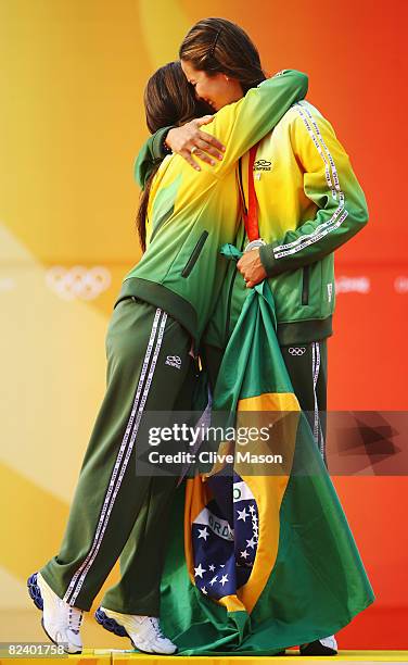 Fernanda Oliveira and Isabel Swan of Brazil celebrate after finishing third in the Women's 470 class event held at the Qingdao Olympic Sailing Center...