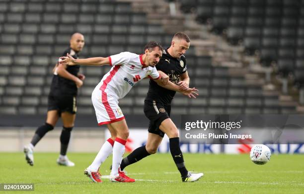 Andy King of Leicester City in action with Ed Upson of MK Dons during the pre season friendly between MK Dons and Leicester City on July 28th, 2017...