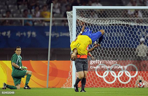 Germany's goalkeeper Nadine Angerer looks at Brazil's Cristiane after scoring a goal during the 2008 Beijing Olympic Games women's semi-final...