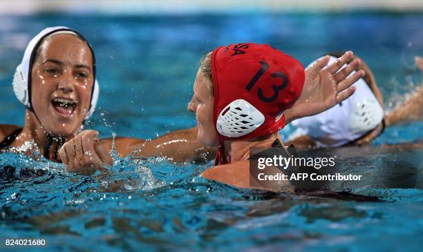 Players celebrate their victory over Spain in 'Hajos Alfred' swimming pool of Budapest on July 28, 2017 after the woman final of FINA2017 world...