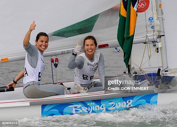 Sailors Fernanda Oliveira and Isabel Swan of Brazil of the 470 women's class celebrate their bronze medal placing at the 2008 Beijing Olympic Games...