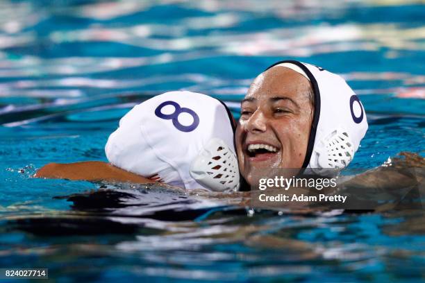 Kiley Neushul of United States and Margaret Steffens of United States celebrate following their team's 13-6 victory during the Women's Water Polo...