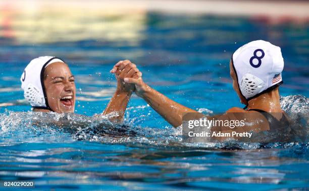 Margaret Steffens of United States and Kiley Neushul of United States celebrate following their team's 13-6 victory during the Women's Water Polo...