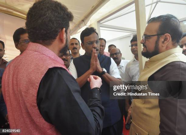 Vinod Tawde interacts with Abu Azmi and Waris Pathan at Vidhan Bhavan during the monsoon assembly on July 28, 2017 in Mumbai, India.